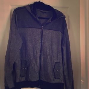Zip up light weight sweater with hood.
